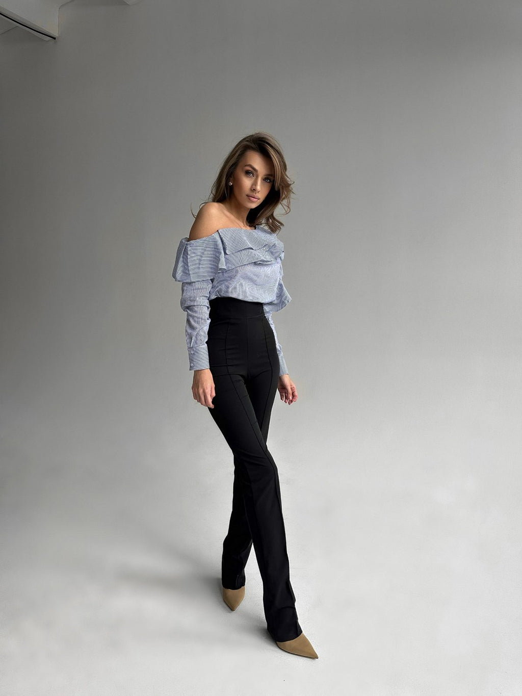 One-shoulder ruffle blouse in blue and white stripe stretch cotton — GLOWSYOU asymmetric long sleeve top and black pants
