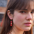 Coral gemstone asymmetric gold huggie earrings | by Ifemi Jewels